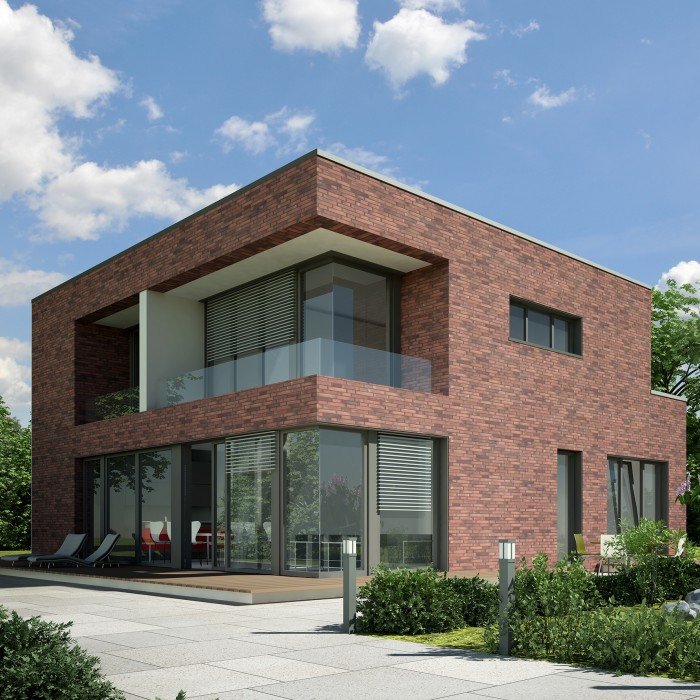 Moderne bakstenen woning met grote zwarte raamprofielen en houten terras.